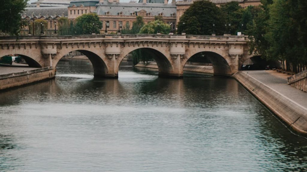 Enchanting view of a historic bridge over the Seine River in Paris, France.