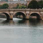 Enchanting view of a historic bridge over the Seine River in Paris, France.