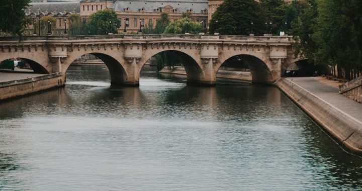 Enchanting view of a historic bridge over the Seine River in Paris, France.